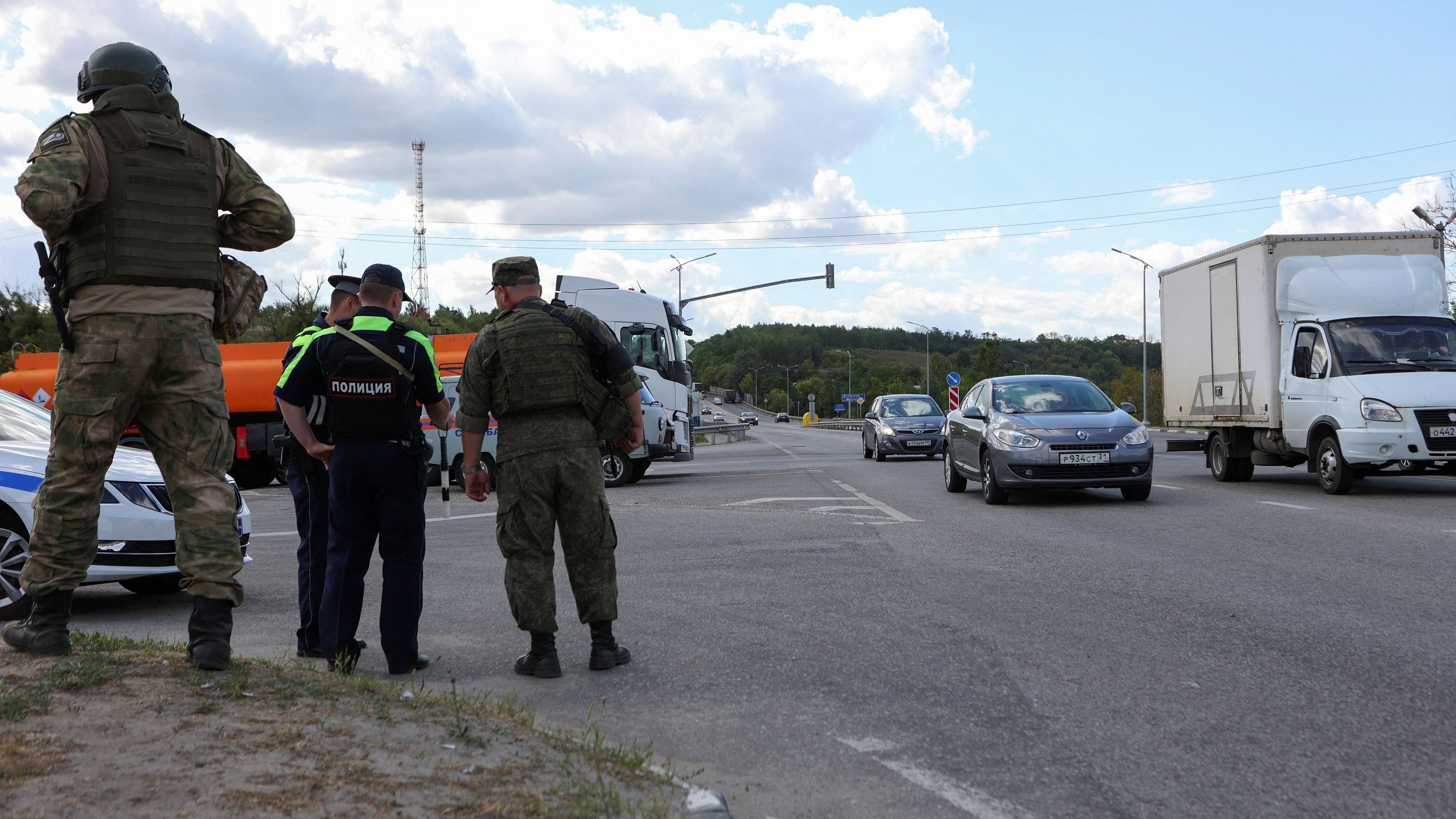 <div class="paragraphs"><p>Russian law enforcement officers stand guard at a checkpoint in Belgorod.</p></div>